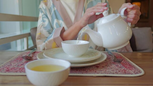 Tea service on patterned placemat in Tashkent