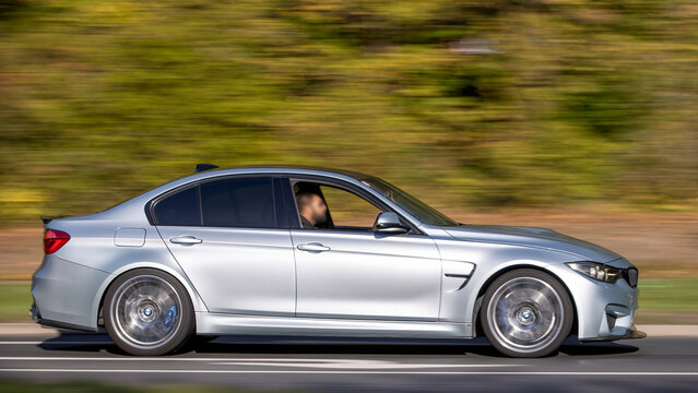 Milton Keynes; UK - Oct. 18th 2026:   BMW M3 F80 generation car driving on a British road