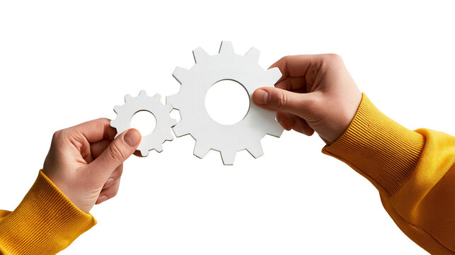 Hands holding two white interlocking gear wheels representing mechanical connection