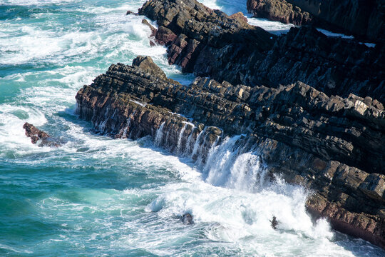Dramatic Coastal Cliffs and Turbulent Ocean Waves