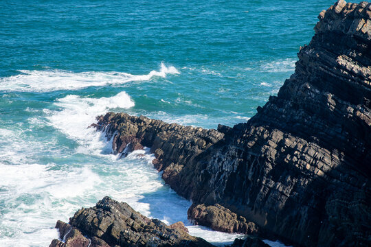 Dramatic Coastal Cliffs with Crashing Turquoise Waves