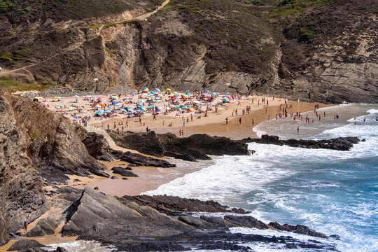 Crowded beach scene with people