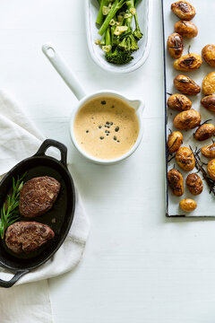 Fillet of beef with pepper sauce, roasted potatoes, and broccoli
