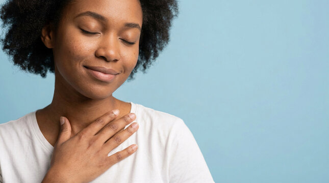 A serene young African American woman embraces inner peace and emotional balance, finding solace through mindfulness and self-care, promoting strong Mental Health and well-being in her daily life