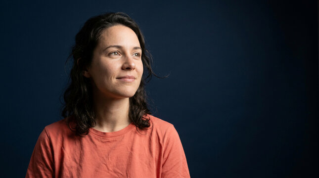 A peaceful young woman with a thoughtful expression, embodying hope and resilience as she focuses on her journey towards robust mental health and personal well-being