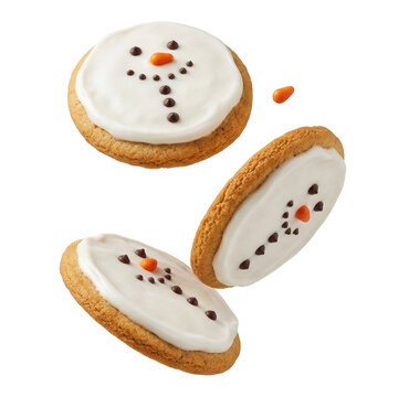 Deliciously decorated snowman cookies featuring sweet white icing, chocolate chip eyes, and orange candy noses are captured in a dynamic, playful arrangement.