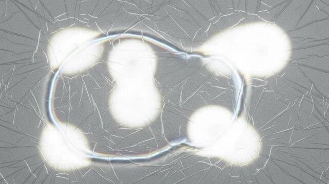Cracked Glass Light Impact Animation, Glowing White Energy Orbs on Shattered Glass Surface with Radiating Fracture Lines, 4K Seamless Loop