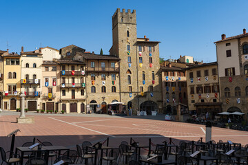 Arezzo historic square with medieval stone tower © tristanbnz