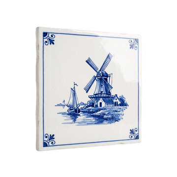 Square glossy ceramic tile hand painted in cobalt blue with a windmill, a sailboat and a canal scene in a Delft style, isolated on transparent background