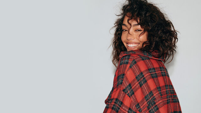 Afro girl with messy hair in oversized flannel shirt grunge style isolated on white background