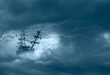 Flying old ship in the stormy clouds with thunder and lightning © muratart