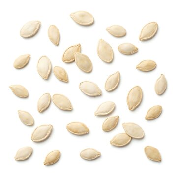 Pile of Raw Pumpkin Seeds Scattered on White Background