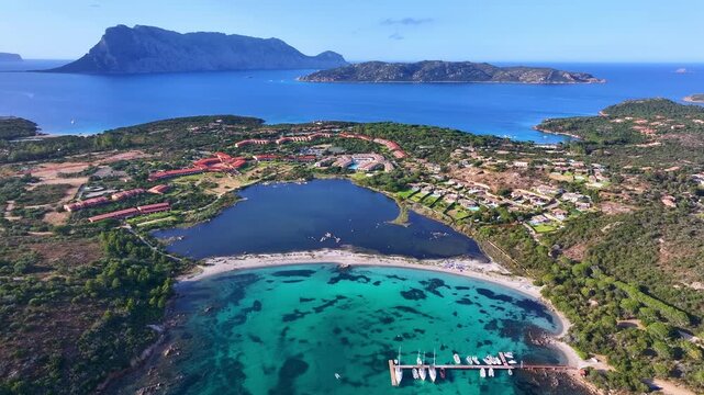 Aerial view of yachts anchored in turquoise water at Brandinchi beach, Sardinia