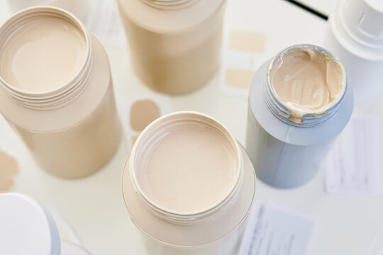 A minimalist setup displaying various cosmetic cream jars, capturing the essence of freshness and the modern aesthetics of beauty products.