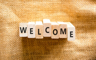 Welcome word symbol. Concept word Welcome on beautiful wooden blocks. Beautiful canvas background. Business welcome word concept. Copy space. © Dzmitry