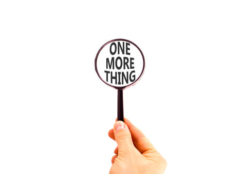 One more thing words symbol. Concept words One more thing in beautiful magnifying glass. Beautiful white background. Businessman hand. Business and one more thing concept. Copy space.