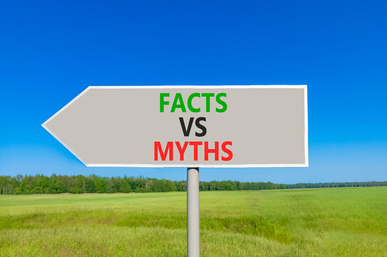 Facts vs versus myths words symbol. Concept words Facts vs Myths on beautiful grey road sign. Beautiful blue sky green grass background. Business and facts vs versus myths concept. Copy space.