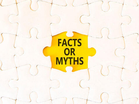 Facts or myths words symbol. Concept words Myths or Facts on beautiful white puzzle. Beautiful yellow background. Business and facts or myths concept. Copy space.