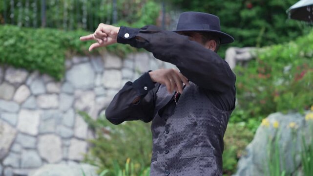 The flamenco dancer is a man. Portrait of a Spaniard. Arm Movements Braceo Palmas Pitos Floreo