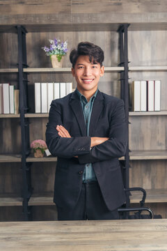 Portrait happiness businessman smiling face confident leader manager in modern city. Asian man handsome success look at camera professional manager. Men standing in suit handsome CEO leader business