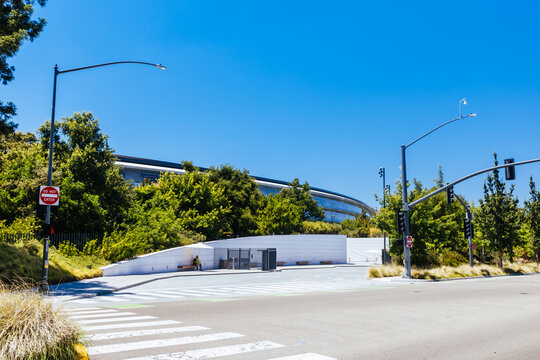 Entrance gate and circular main building at Apple Park campus in Cupertino California