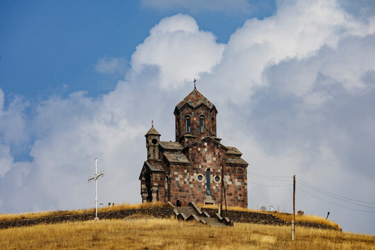 St Sarkis Church atop grassy hill in tsakhunk, Armenia