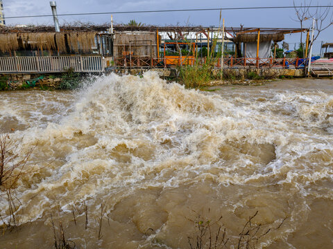 Muddy river overflowing after heavy autumn rainfall