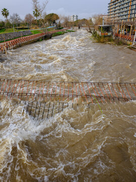 Muddy river overflowing after heavy autumn rainfall