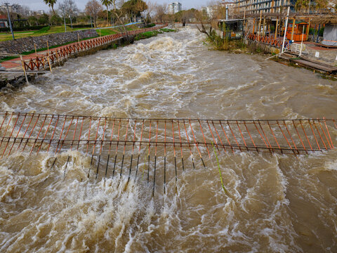 Muddy river overflowing after heavy autumn rainfall