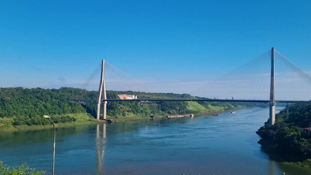 View of the Ponte da Integra&ccedil;&atilde;o, an impressive cable-stayed bridge spanning the Paran&aacute; River and connecting Foz do Igua&ccedil;u in Brazil with Presidente Franco in Paraguay on a bright, sunny day