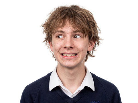 Awkward teenage boy grin transparent background braces school uniform shy looking aside with a nervous smile isolated cutout for advertising social media posts and marketing campaigns
