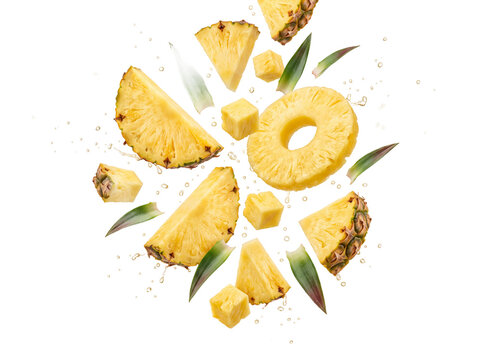 Pineapple slices chunks ring transparent background tropical yellow fruit juicy fresh falling isolated wedges cubes and green leaves burst ideal for smoothie labels beach bar menus and summer ads