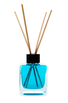 Turquoise reed diffuser in a glass bottle with wooden sticks