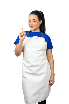 Woman in a white apron pointing a finger up with a smile, on transparent background