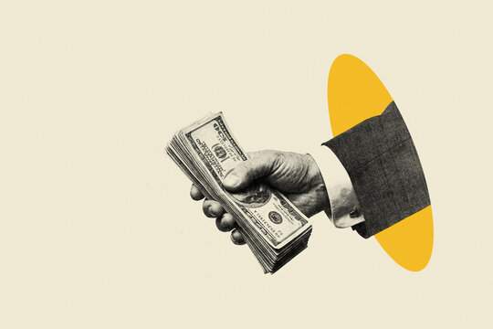 Businessman hand holding stack of cash dollars emerging from hole