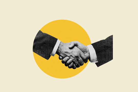 Businessmen shaking hands in agreement on round yellow background