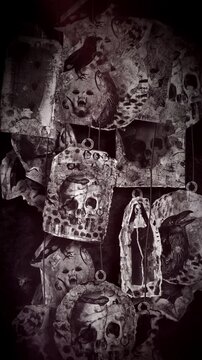 An animated Halloween background featuring hanging elements in a paper-collage style. Each one gently sways on a loop and features spooky ephemera details including creepy skulls, spiders, snakes, eer