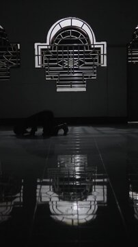 Silhouette of Person Praying in a Mosque