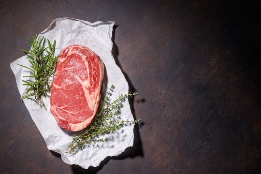 Raw ribeye steak with copy space