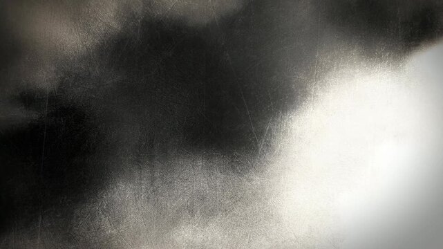 Dark smoke drifts through a monochrome field beside a diffuse glow. Cinematic title, horror design, and music compositing.