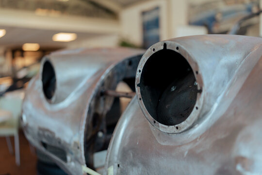 View of a bare metal car body front fender and headlight housing in a workshop in Koudekerke, Zeeland, Netherlands.