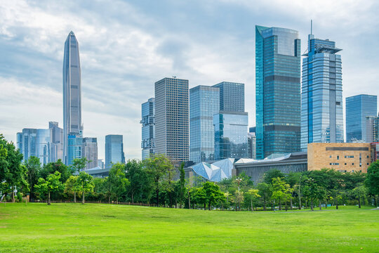 Modern skyscrapers and office high-rise buildings with green park in Futian District, Shenzhen, China. Business district architecture, urban greenery, sustainable city planning
