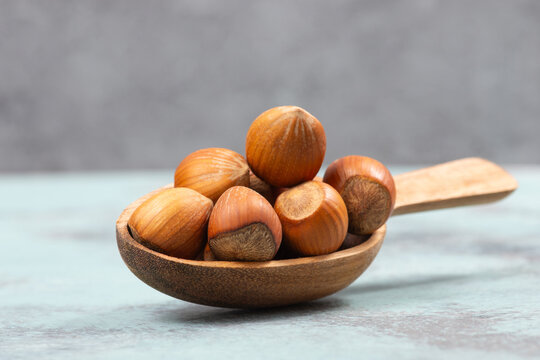 Hazelnuts in a wooden shovel, healthy nuts food, nutrition, ingredients for baking, protein and antioxidants