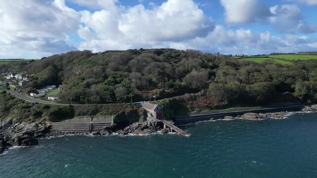 Penlee, Cornwall, England: DRONE VIEWS: The old Penlee lifeboat station. The station was closed down after the 1981 Penlee lifeboat disaster, when sixteen people lost their lives in a failed rescue.