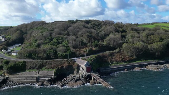 Penlee, Cornwall, England: DRONE VIEWS: The old Penlee lifeboat station. The station was closed down after the 1981 Penlee lifeboat disaster, when sixteen people lost their lives in a failed rescue.