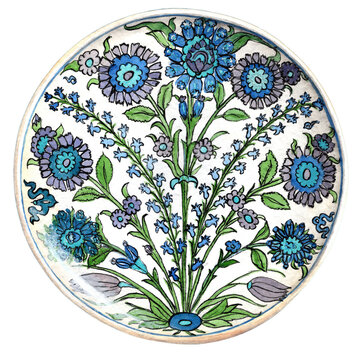 Ottoman Iznik ceramic dish decorated with blue and green floral saz motifs, Turkey circa 1540-1550. Ancient Turkish glazed pottery plate, fine art. Artwork.