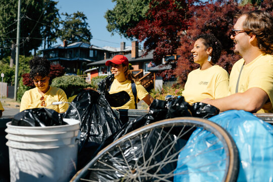 Community volunteers cleaning neighborhood park together