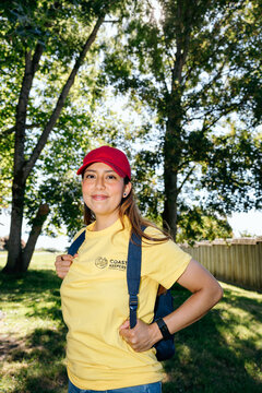 Coast Keepers volunteer smiling outdoors with backpack