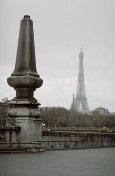 Stone Obelisk and Distant Eiffel Tower