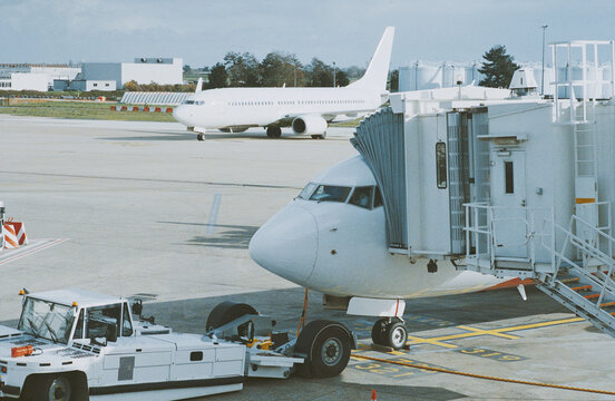 Aircraft Nose Beside Boarding Bridge